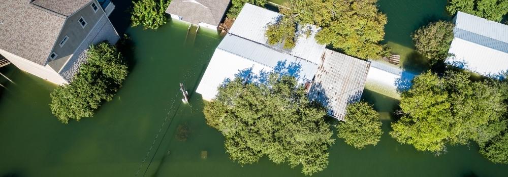 How to protect against flooding in a home with an aerial view of flood directions.