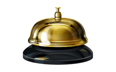 A small service desk bell with a brass body and a black base.