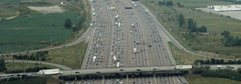 Aerial view of an overpass bridge above the 401 in Toronto.
