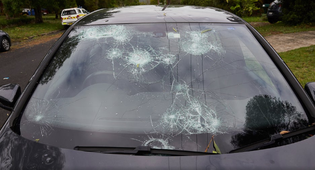 Car with a hail damaged windshield protected with comprehensive insurance coverage