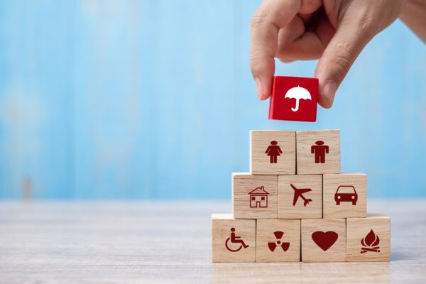 multiple wood blocks representing insurance coverage and the 3 types of insurance in ontario